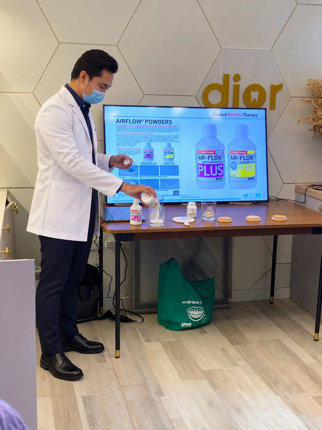 SPMS representative explaining EMS powders during an in-clinic product orientation